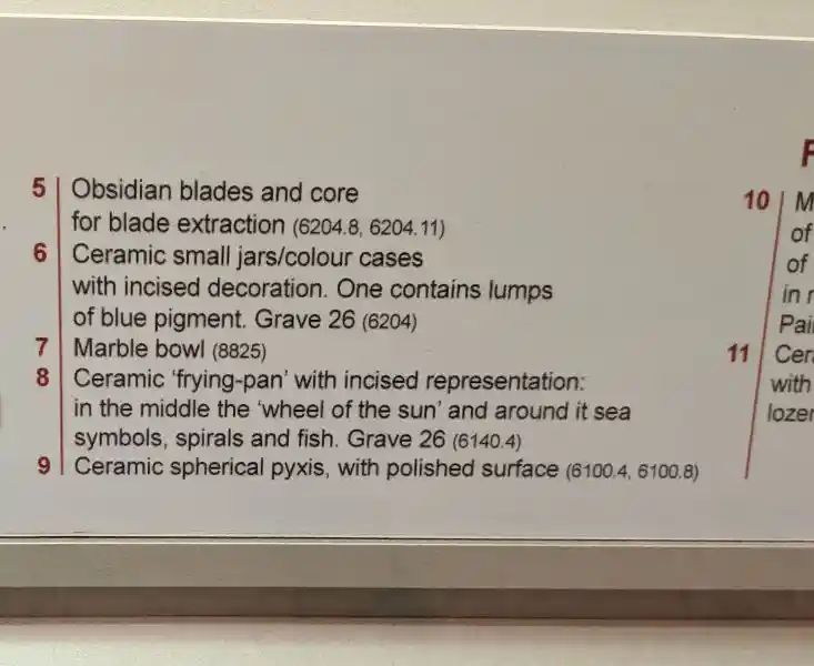 Early Bronze Age ceramic frying pan decorated with impressed spirals and incised pubic triangle from Grave 307, Syros
